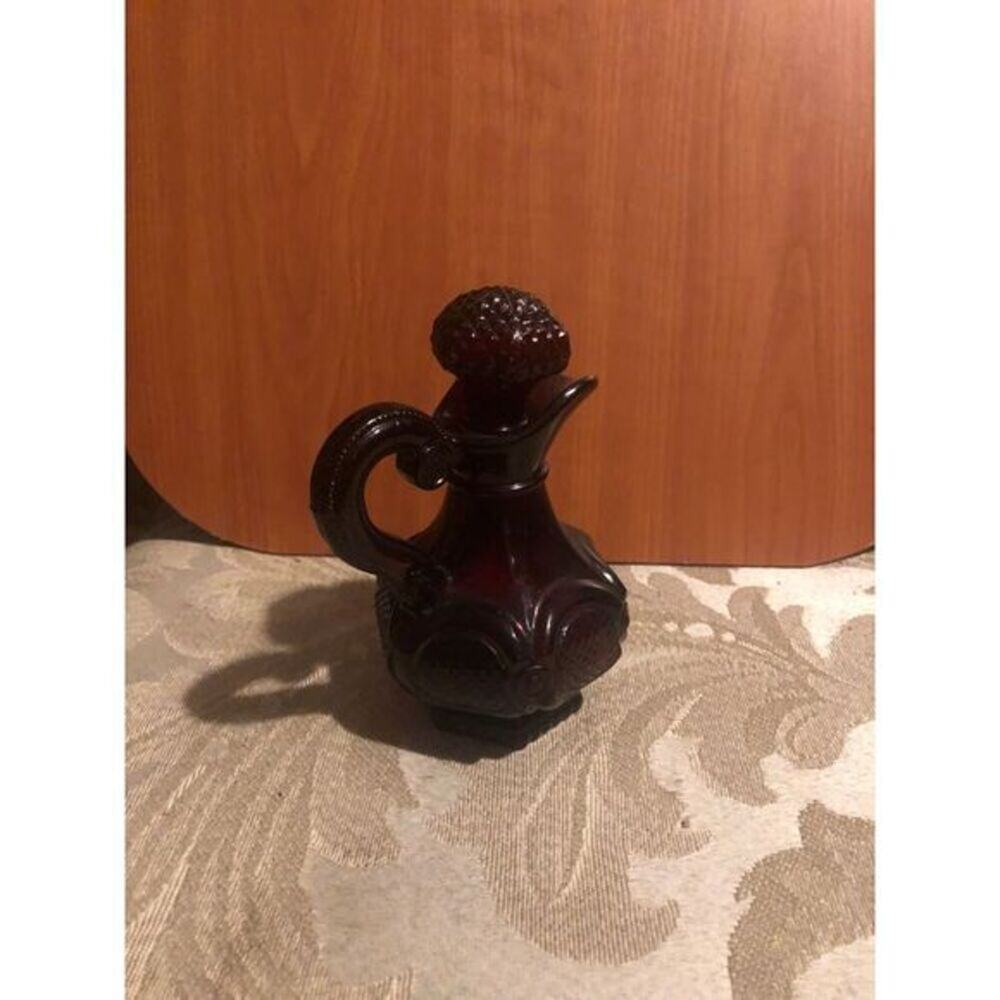 This is a vintage Avon 1876 Cape Cod Collection ruby red glass cruet.